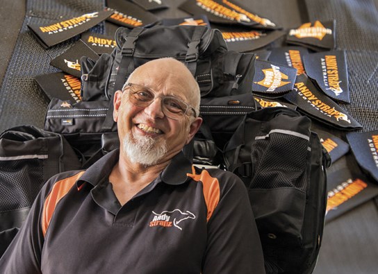 andy strapz white head shot with backgroundlr.jpg